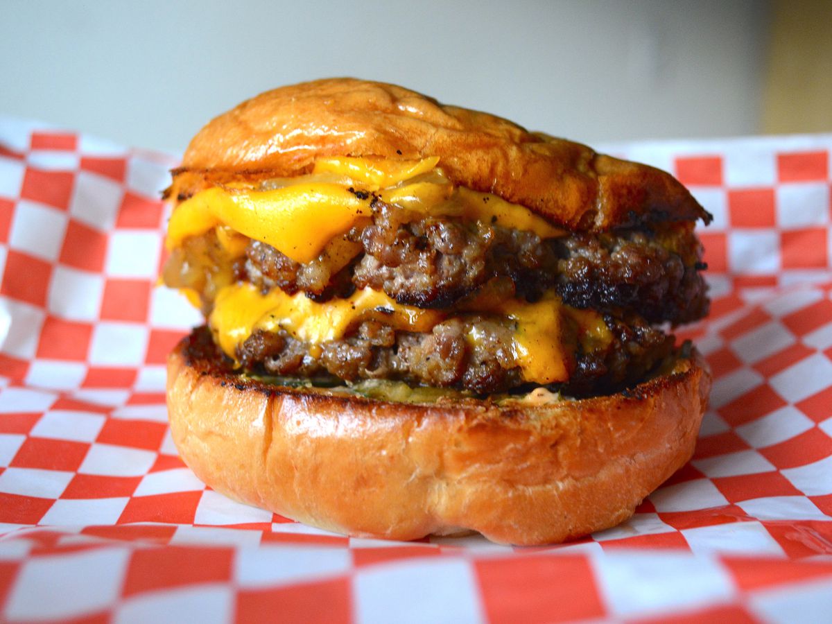 Double cheeseburger with onions and pickles