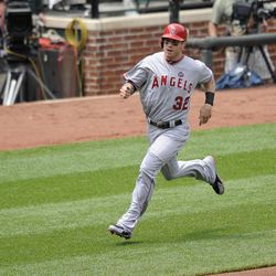 Los Angeles Angels' Josh Hamilton (32) races home to score on an RBI double by Howie Kendrick during the fourth inning of a baseball game against the Baltimore Orioles, Wednesday, June 12, 2013, in Baltimore. 