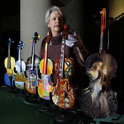 Reva Anderson of the Utah Symphony Guild sets up violins for display on Jan. 7, 2011 in Abravanel Hall in Salt Lake City before the symphony concert. Anderson has been a member of the Utah Symphony Guild for the past 10 years and will be stepping down after this season.