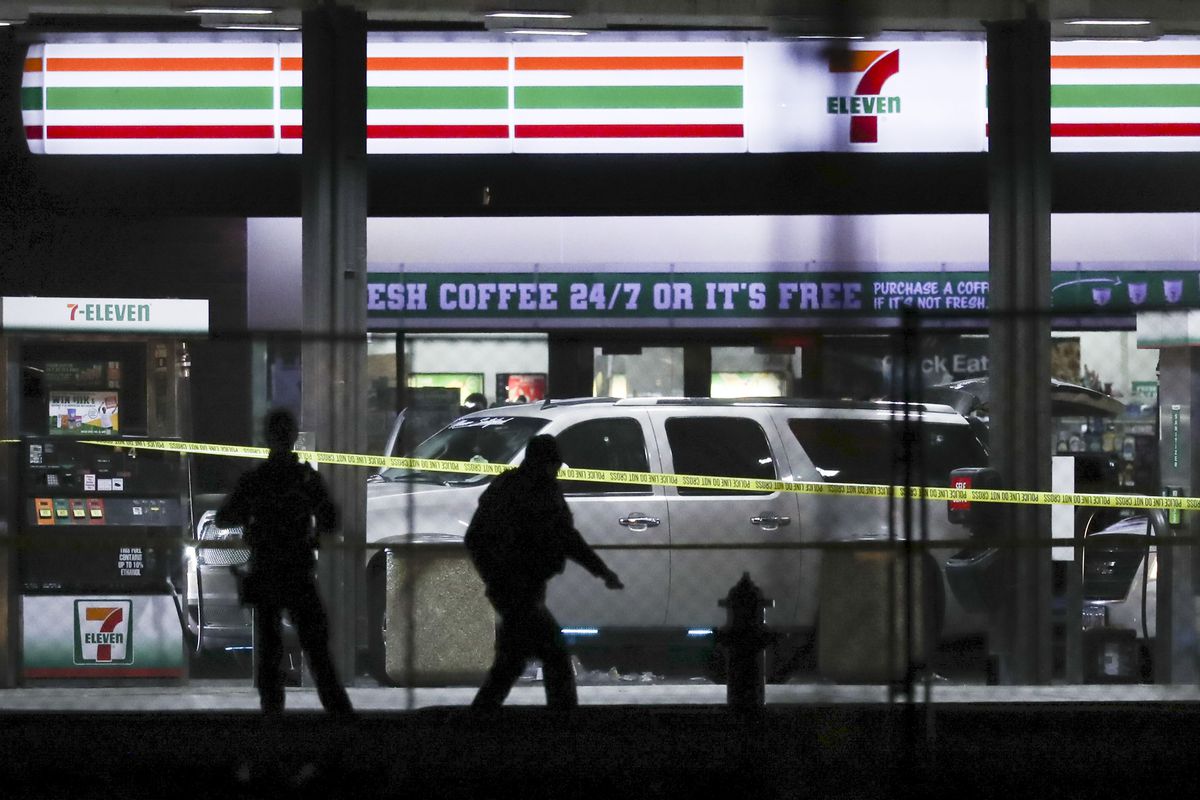 Crime tape and a heavy police presence surround a 7-11 in Taylorsville on Wednesday, Dec. 1, 2021. 