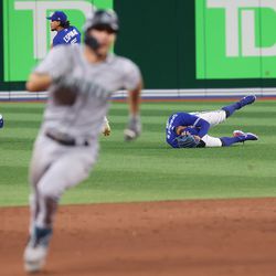 Three runs scored after Toronto Blue Jays shortstop Bo Bichette (11) and Toronto Blue Jays center fielder George Springer (4) collided trying to catch a Seattle Mariners shortstop J.P. Crawford (3) blooper as the Toronto Blue Jays fall to the Seattle Mariners 10-9