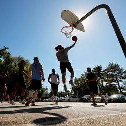 A group of men play basketball at Liberty Park in Salt Lake City on Sunday, Sept. 1, 2019.
