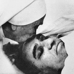 In this March 23, 1980, file photo, a nun plants a kiss on the forehead of Archbishop Oscar Arnulfo Romero of El Salvador at the Hospital of Divine Providence. Pope Francis decreed Tuesday, Feb. 3, 2015, that the slain Salvadoran Archbishop was killed in 1980 out of hatred for his Catholic faith, approving a martyrdom declaration that sets the stage for his beatification. (AP Photo, File)