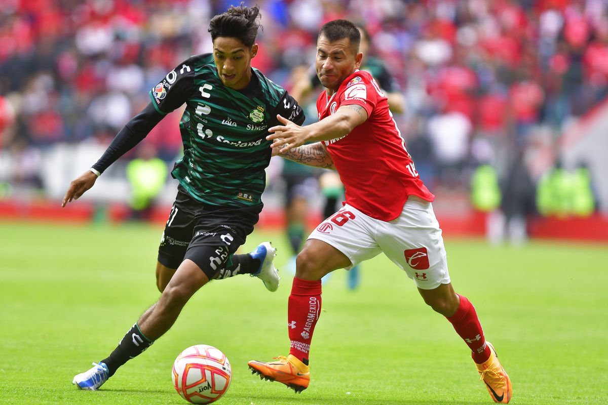 Jair Gonzalez (L) of Santos fights for the ball with Jean Meneses (R) of Toluca during the 4th round match between Toluca and Santos Laguna as part of the Torneo Apertura 2022 Liga MX at Nemesio Diez Stadium on July 23, 2022 in Toluca, Mexico.