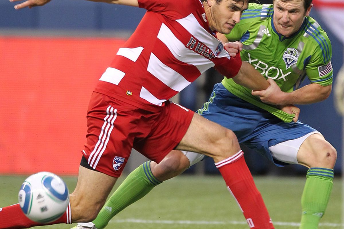 SEATTLE - MAY 25:  Michael Fucito #2 of the Seattle Sounders FC battles George John #14 of FC Dallas at Qwest Field on May 25, 2011 in Seattle, Washington. FC Dallas defeated the Sounders 1-0. (Photo by Otto Greule Jr/Getty Images)