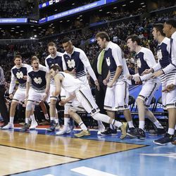 FILE - In this March 18, 2016, file photo, Notre Dame cheers for Matt Farrell after Farrell made a 3-point basket during the second half of a first-round men's college basketball game against Michigan in the NCAA Tournament, in New York. Farrell made his first two career starts in the Fighting Irish’s NCAA Tournament games. 
