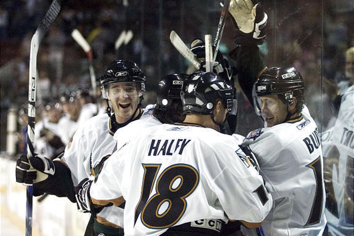 Utah Grizzlies celebrate a goal against the Idaho Steelheads in their home opener on Friday night.