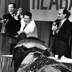A circus elephant noses up to Ronald Reagan as Orrin Hatch and Jake Garn applaud at the Utah Republican Convention in June  1980.