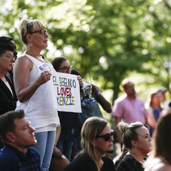 Denise Dial holds a sign during a vigil for Mackenzie Lueck on the Union lawn at the University of Utah in Salt Lake City on Monday, July 1, 2019. Dial knew Lueck's family since she was a child. The vigil was organized by the Associated Students of the University of Utah.
