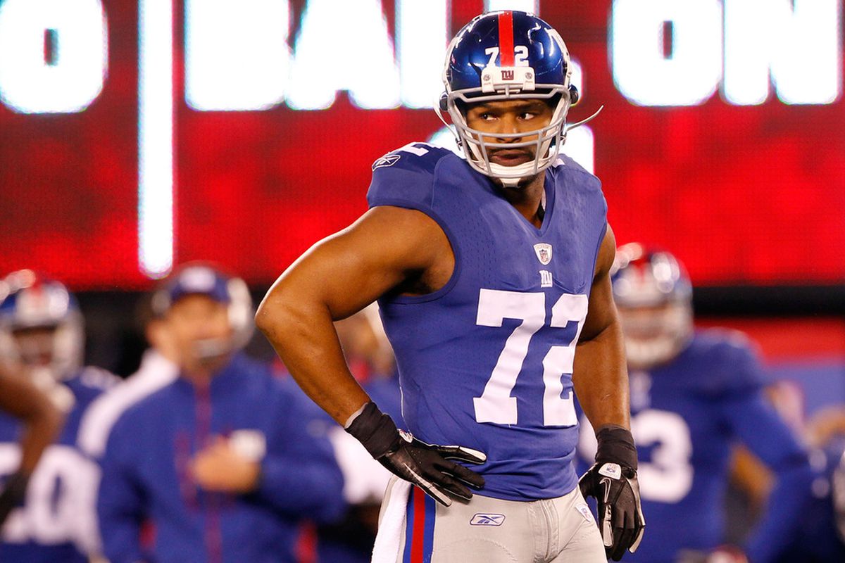 Osi Umenyiora of the New York Giants looks on against the Dallas Cowboys at MetLife Stadium on January 1, 2012 in East Rutherford, New Jersey.  (Photo by Rich Schultz/Getty Images)