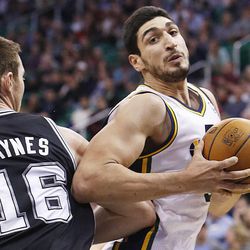 Utah Jazz's center Enes Kanter (0) spins around Spurs' Aron Baynes as the Utah Jazz and the San Antonio Spurs play Saturday, Dec. 14, 2013 at EnergySolutions Arena in Salt Lake City. The Spurs won 100-84.