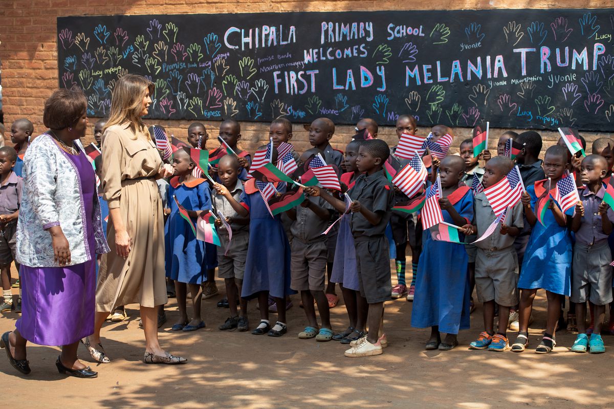 US First Lady Melania Trump (2nd L) visits Chipala Primary School alongside head teacher Maureen Masi (L) on October 4, 2018 during a 1-day visit in Malawi, part of her week long trip to Africa to promote her ‘Be Best’ campaign. 