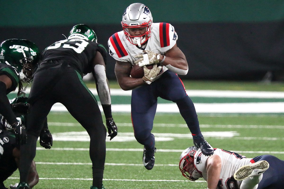 New England Patriots running back Damien Harris (37) leaps through a hole on the Patriots drive for a first quarter touchdown.