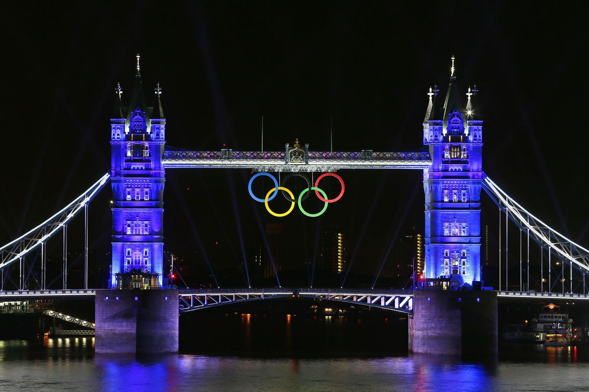 Jul 25, 2012; London, UNITED KINGDOM; Tower Bridge sports the Olympic rings and is lit up with blue light in preparation for the 2012 London Olympic Games opening ceremony Friday. Mandatory Credit: Rob Schumacher-USA TODAY Sports via US PRESSWIRE