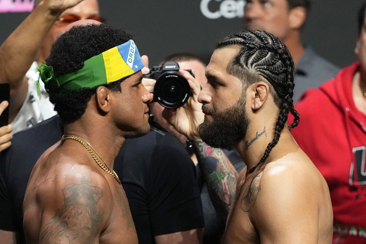 Opponents Gilbert Burns of Brazil and Jorge Masvidal face off during the UFC 287 ceremonial weigh-in at Kaseya Center on April 07, 2023 in Miami, Florida.