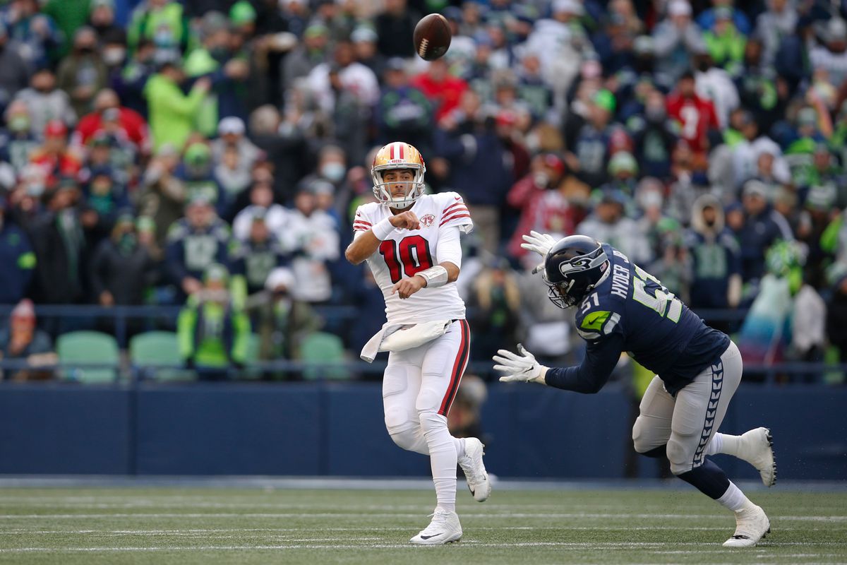 Jimmy Garoppolo #10 of the San Francisco 49ers passes during the game against the Seattle Seahawks at Lumen Field on December 5, 2021 in Seattle, Washington.