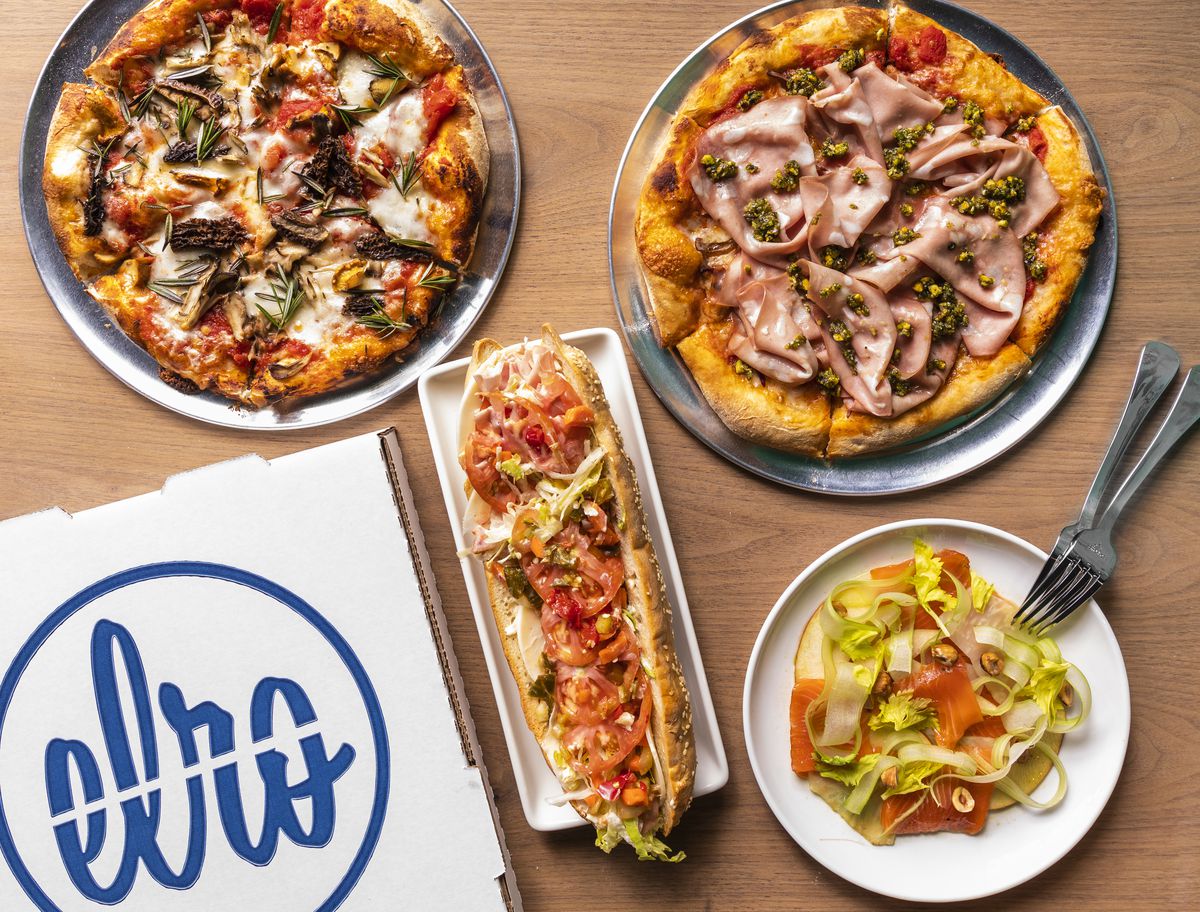 A pizza covered in mortadella, a pizza topped with mushroom, nepitlla-cured salmon, and a hoagie, with a pizza box that says “Elro.”