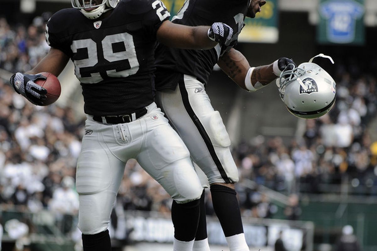 Michael Bush #29 and Darren McFadden #20 of the Oakland Raiders celebrate after Bush scored on a touchdown on a one yard run against the New York Jets September 25, 2011