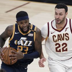 Utah Jazz’s Royce O’Neale (23) drives against Cleveland Cavaliers’ Larry Nance Jr. (22) during the first half of an NBA basketball game Tuesday, Jan. 12, 2021, in Cleveland. 