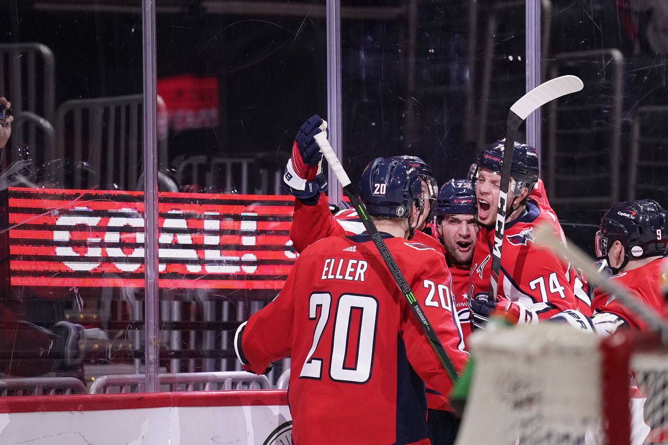 Conor Sheary #73 of the Washington Capitals celebrates with his teammates after scoring a goal against the Boston Bruins in the third period in Game Five of the First Round of the 2021 Stanley Cup Playoffs at Capital One Arena on May 23, 2021 in Washington, DC.