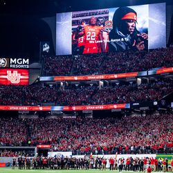 Utah Utes players and fans honor Aaron Lowe and Ty Jordan during the Pac-12 championship game against the Oregon Ducks at Allegiant Stadium in Las Vegas on Friday, Dec. 3, 2021.