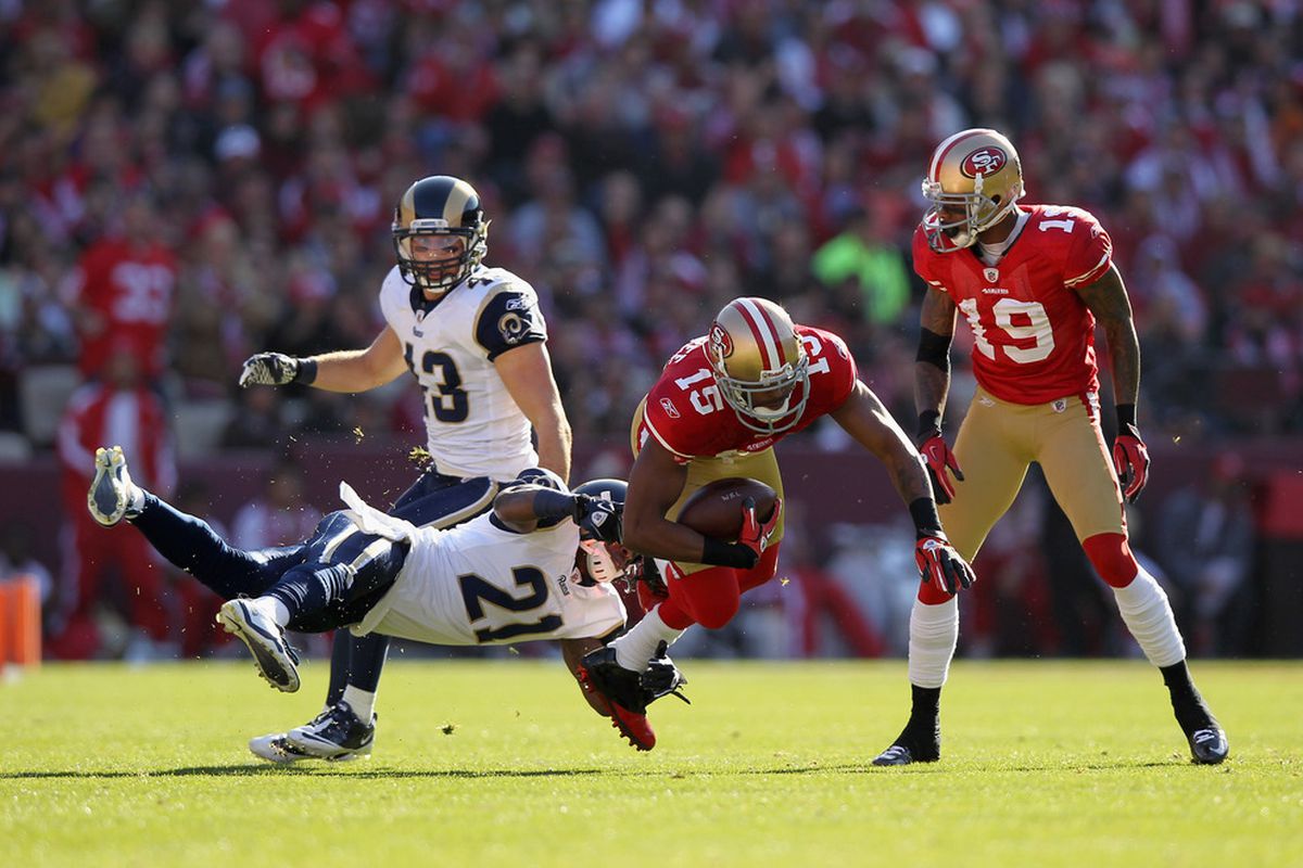 SAN FRANCISCO, CA - DECEMBER 04:  Michael Crabtree #15 of the San Francisco 49ers is tackled by Justin King #21 of the St. Louis Rams at Candlestick Park on December 4, 2011 in San Francisco, California.  (Photo by Ezra Shaw/Getty Images)