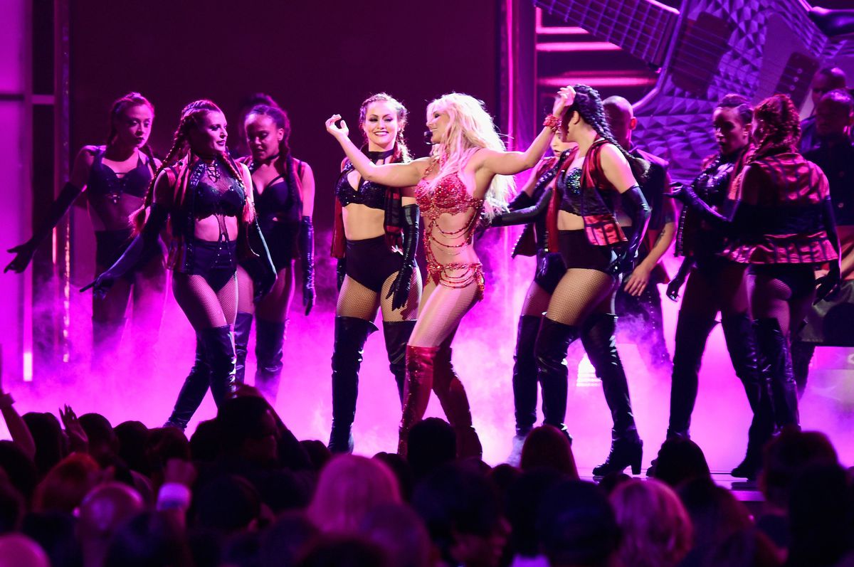 Britney Spears performing with backup dancers at the Billboard Music Awards