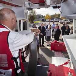 Paul Ayers, a Red Cross Disaster Assistance Team supervisor, stands inside one of 10 new emergency response vehicles as Stan Rosenzweig, a member of the American Red Cross' Greater Salt Lake board, points out its features to Bishop W. Christopher Waddell, second counselor in The Church of Jesus Christ of Latter-day Saints' Presiding Bishopric, Sister Jean B. Bingham, general president of the church's Relief Society, and Bishop Dean M. Davies, first counselor in the church's Presiding Bishopric in Murray on Friday, Oct. 26, 2018. The church donated $1.5 million for the new vehicles.