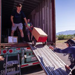 Aamina Khaleel, left, Jared Ballard, Luke Nelson and Mariam Kergaye load boxes of donated supplies bound for Jordan in Riverdale on Saturday, Aug. 19, 2017. Lifting Hands International and Helping Hand for Relief and Development  collected and prepared the donated supplies.