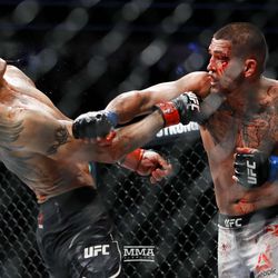 Anthony Pettis counters Tony Ferguson with a right hand