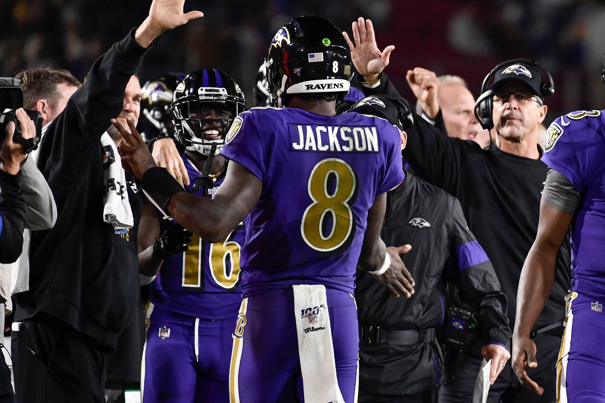 Baltimore Ravens quarterback Lamar Jackson heads to the bench after throwing a short touchdown pass in the third quarter against the Los Angeles Rams at Los Angeles Memorial Coliseum.