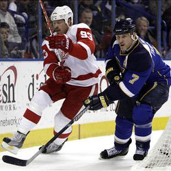 Detroit Red Wings' Johan Franzen, left, of Sweden, tries to find his way around St. Louis Blues' Keith Tkachuk.