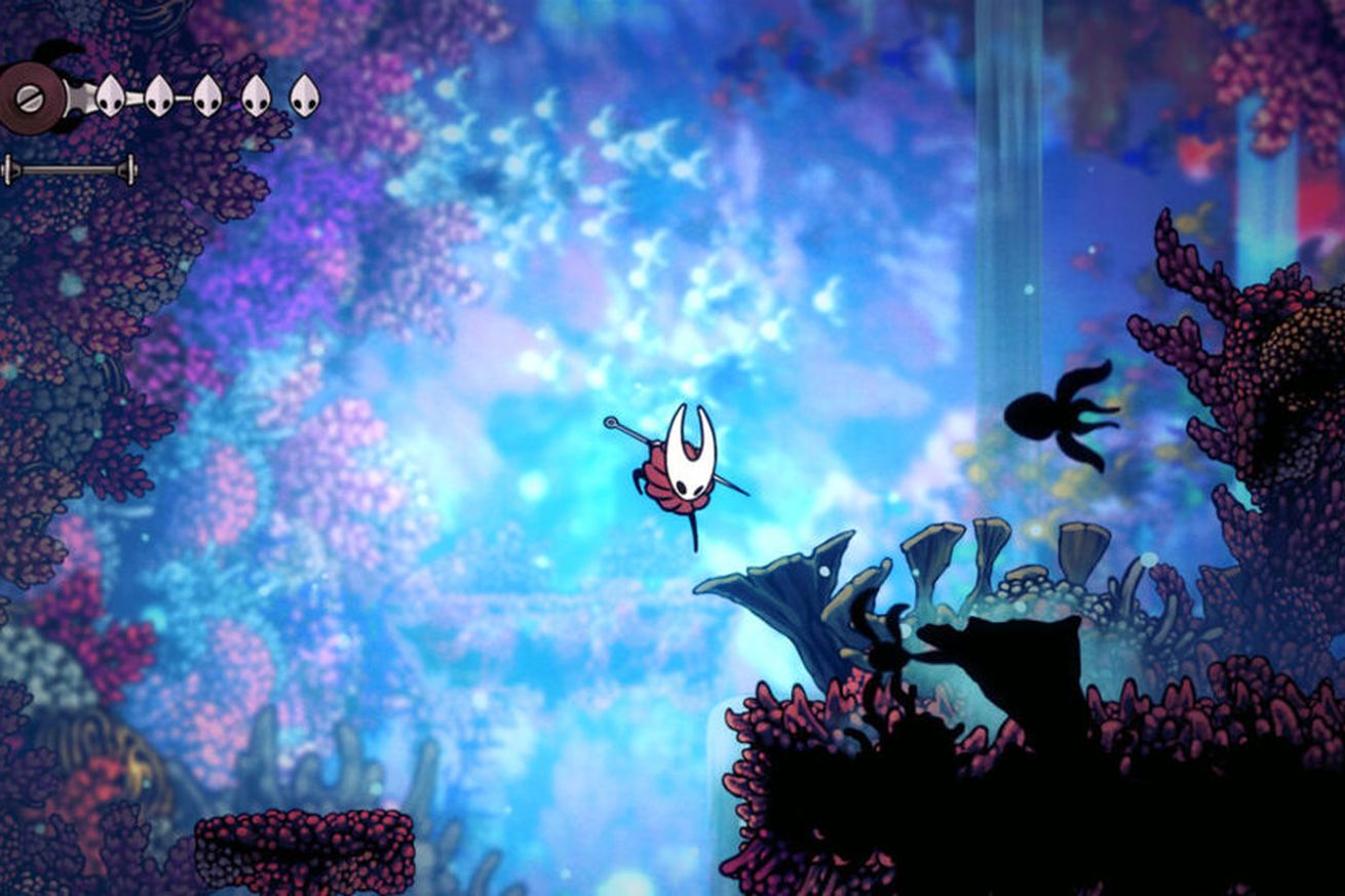 The Hollow Knight character, Hornet, jumps into an environment that appears to be filled with coral.