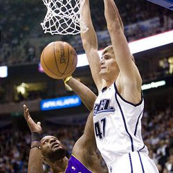 Utah's Andrei Kirilenko dunks over L.A.'s Lamar Odom at EnergySolutions Arena on Wednesday. Los Angeles Lakers won 96-81.