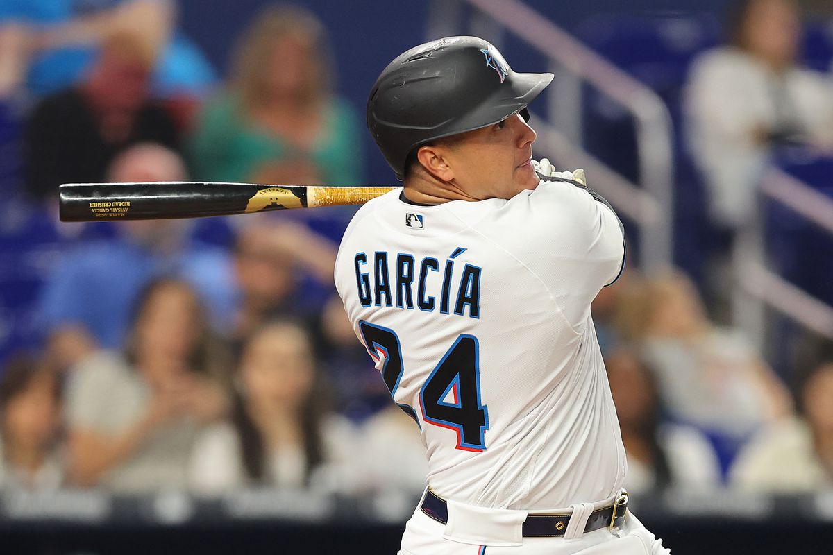 Avisail Garcia #24 of the Miami Marlins hits a solo home run during the second inning against the Washington Nationals at loanDepot park on May 16, 2022 in Miami, Florida.