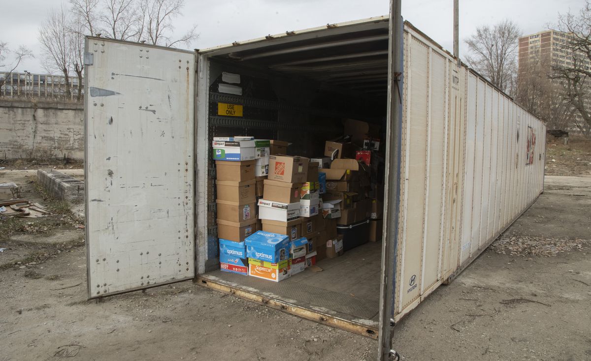 The recovered container holding holiday donations for Kidz Korna has been returned to its original location on Parnell Avenue in Englewood. Organizers have begun restocking donations in the container.