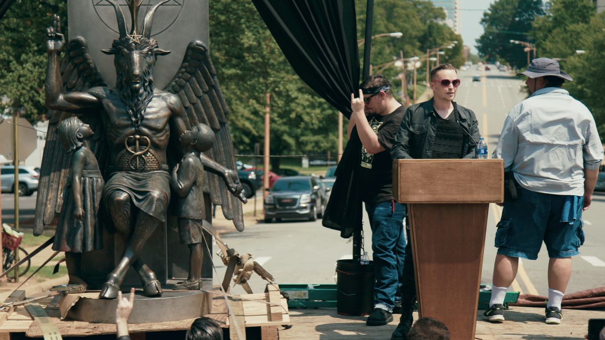 Lucien Greaves, spokesman and co-founder of the Satanic Temple, with the statue of Baphomet.