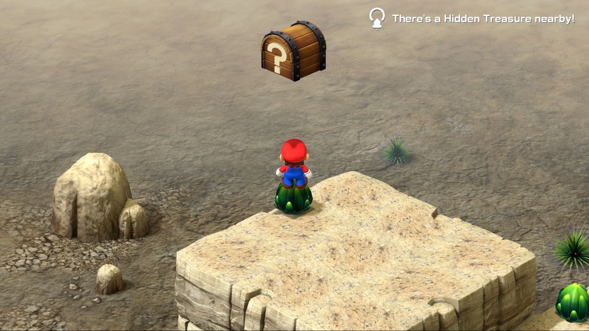 Mario stands on top of an artichoke-like plant in the desert in Super Mario RPG.