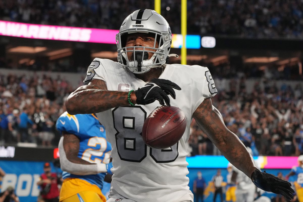 Las Vegas Raiders tight end Darren Waller (83) celebrates after catching a pass for a touchdown against the Los Angeles Chargers during the second half at SoFi Stadium.&nbsp;