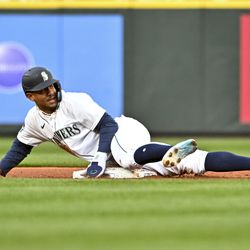 Julio Rodriguez #44 of the Seattle Mariners steals second base during the first inning against the Cleveland Guardians at T-Mobile Park on April 01, 2023 in Seattle, Washington.