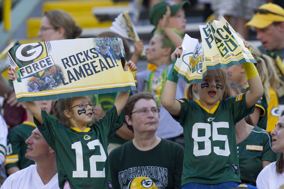 August 3, 2012; Green Bay, WI, USA; Green Bay Packers fans cheer prior to the family night scrimmage at Lambeau Field in Green Bay, WI. Mandatory Credit: Jeff Hanisch-US PRESSWIRE