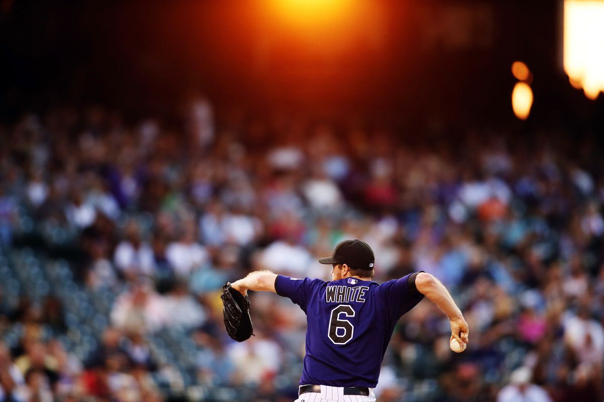 August 16, 2012; Denver, CO, USA; Colorado Rockies pitcher Alex White (6) delivers a pitch during the third inning against the Miami Marlins at Coors Field.  Mandatory Credit: Chris Humphreys-US PRESSWIRE