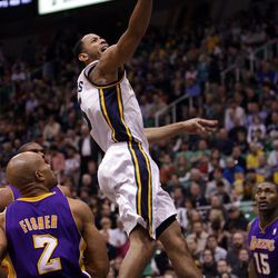 Utah Jazz point guard Devin Harris (5) drives on teh Los Angeles Lakers point guard Derek Fisher (2) in Salt Lake City  Saturday, Feb. 4, 2012. 