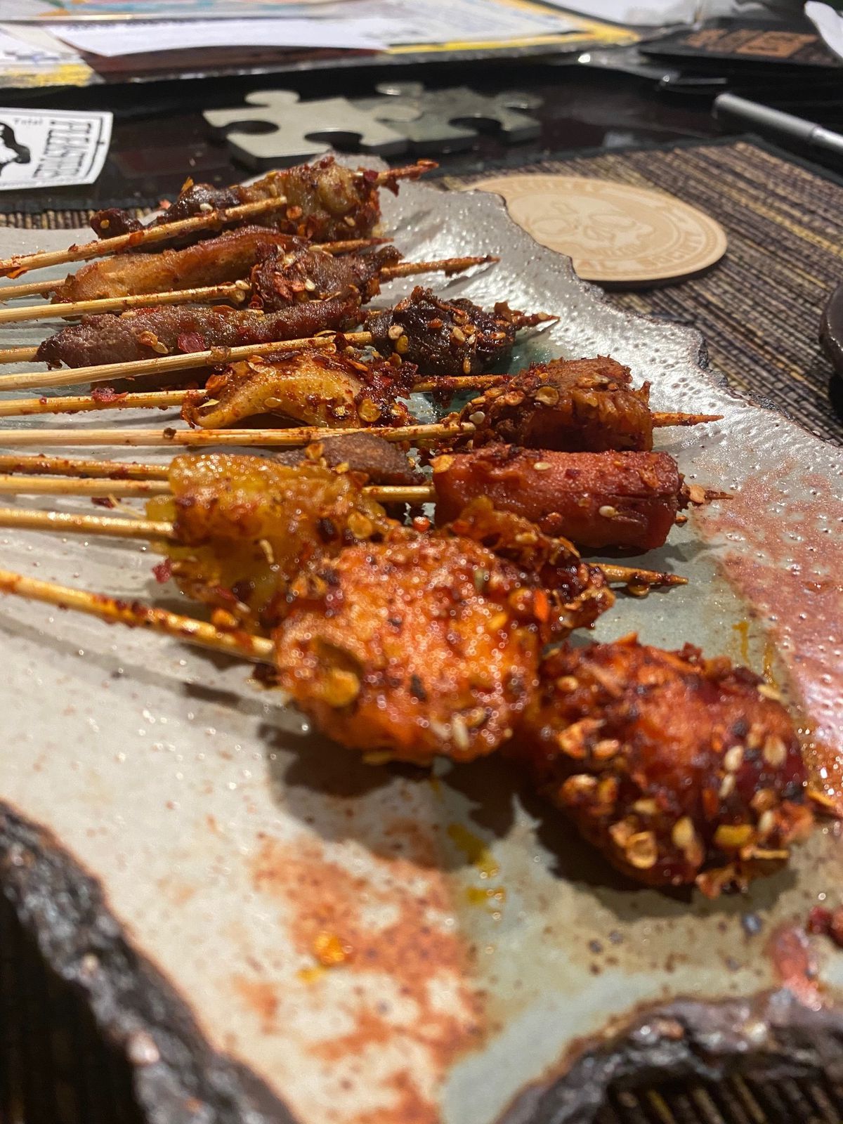 A spread of Sichuan meat skewers on a plate