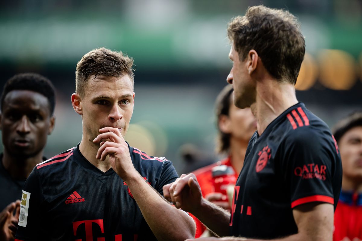 Joshua Kimmich in deep conversation with Thomas Müller after a recent game against Werder Bremen.