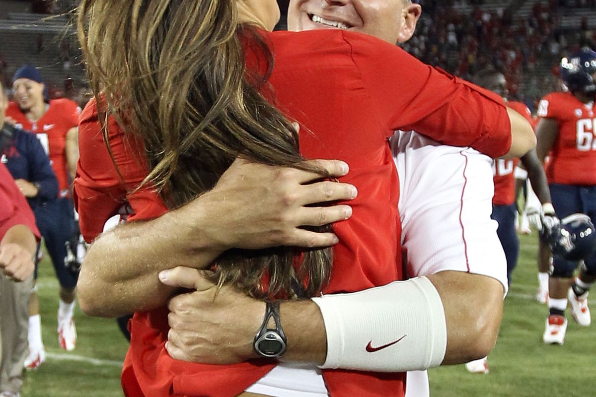 Rich Rod celebrating with his daughter. /SportsbyBrooks'd (Photo by Christian Petersen/Getty Images)