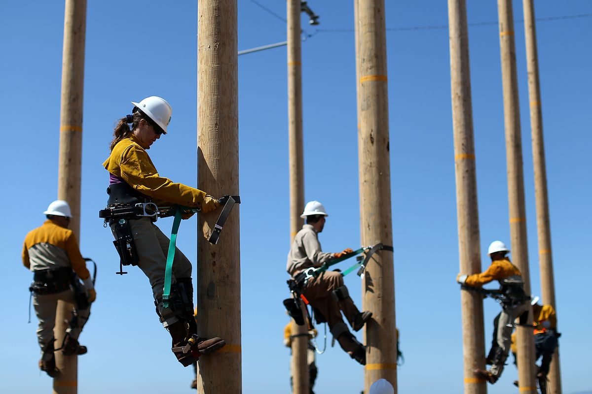 Utility Worker Trainees Learn Pole-Climbing Skills
