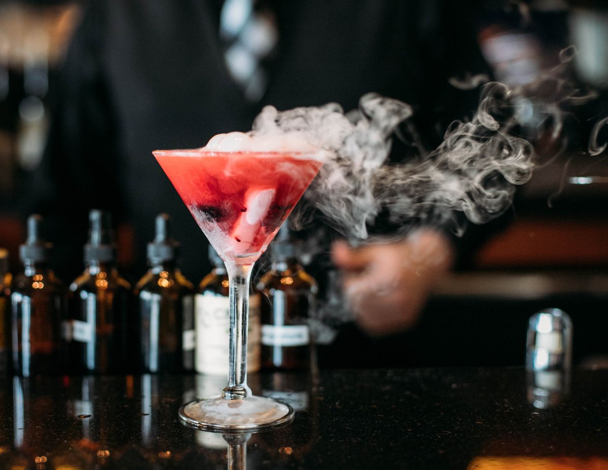 A red cocktail with smoke 