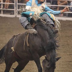 Heath Ford, from Slocum, Texas, rides bareback during the final day of the Days of '47 Rodeo at Energy Solutions Arena on July 26.
