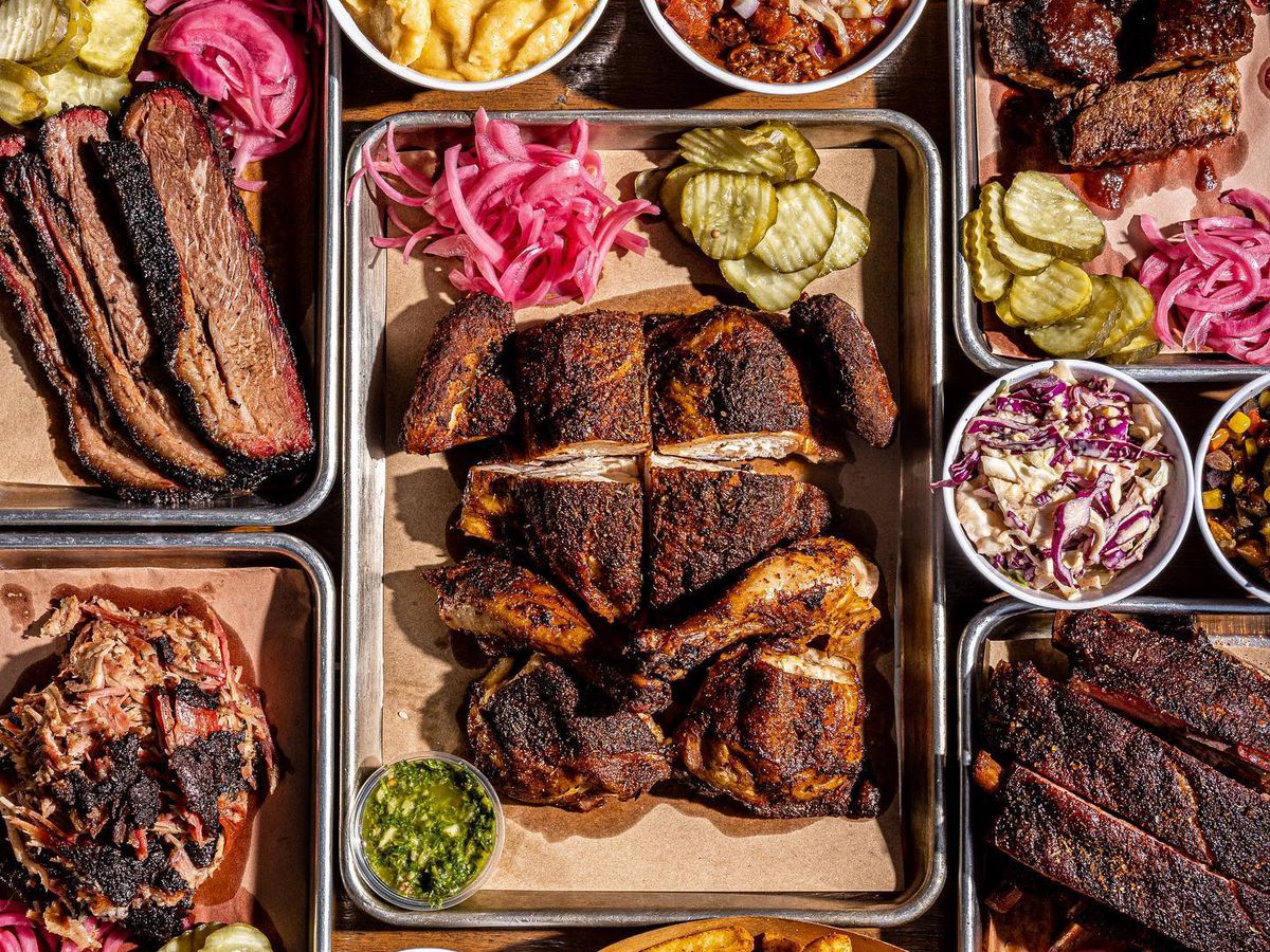 A variety of barbecue dishes like smoked chicken and ribs.